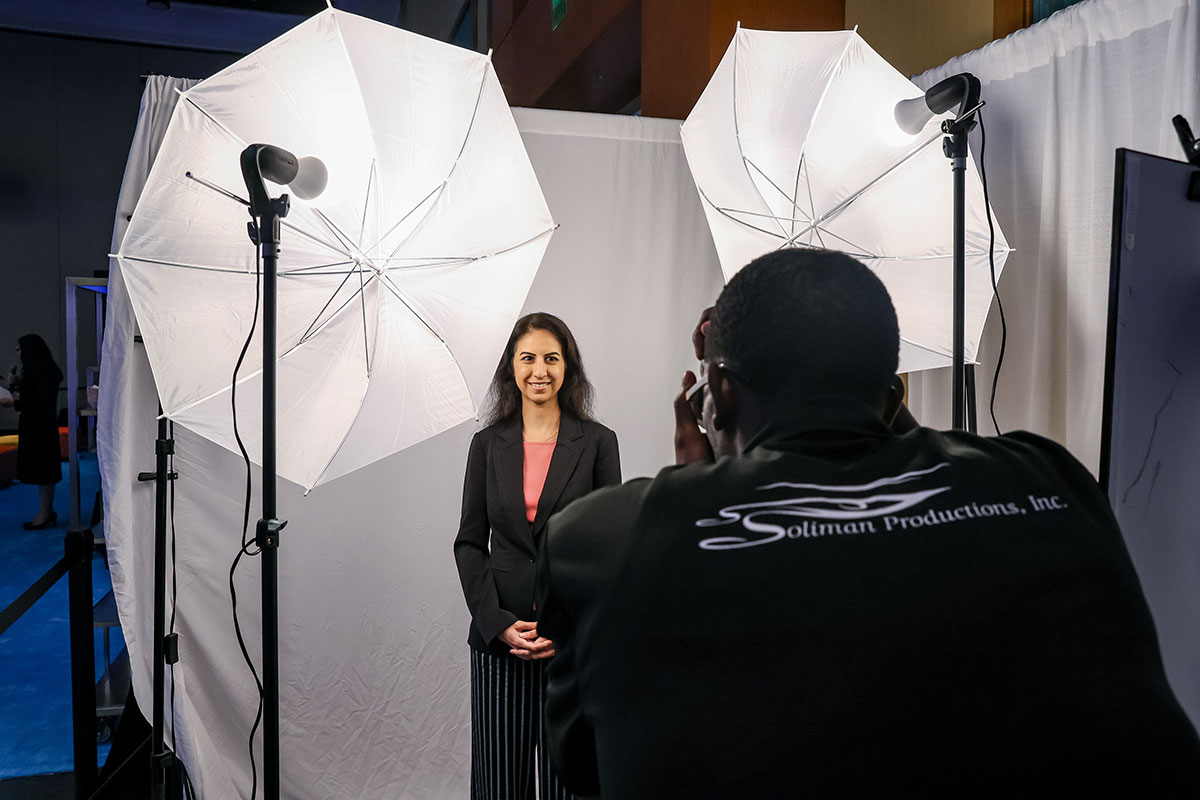 Attendee getting headshot taken by photographer. 
